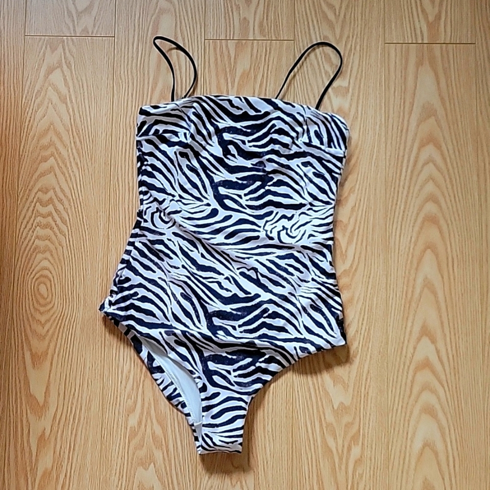 One piece bathing suit, size 4